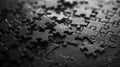 A close-up of a pile of black puzzle pieces, creating a textured background Royalty Free Stock Photo