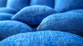 A close up of a pile of blue pillows on top of each other, AI