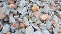 Close up of pile of broken red bricks, fragments of tiles and concrete