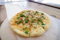 Close up pile of Caucasian khychin bread pie with stuffing