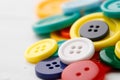 Close up of pile of colorful buttons on white background Royalty Free Stock Photo