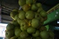 Close up of pile of fresh local green apples in fruit basket hanging on traditional fruit shop for sale Royalty Free Stock Photo