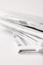 close up of pile of daily newspapers, selective focus on white Royalty Free Stock Photo