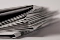 close up of pile of newspapers, selective focus on white