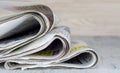 A close up of a pile of newspapers