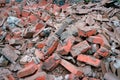 Heap of broken old red brick close-up. Red brick texture Royalty Free Stock Photo