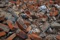 Heap of broken old red brick close-up. Red brick texture folded and laid out in one plane Royalty Free Stock Photo