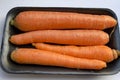 Close-up of a pile of orange carrots in a market