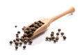 Close-up of pile of Pimento, Bahar seeds spice in a wooden spoon