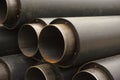 Close-up of a pile of pipes for underground heating mains Royalty Free Stock Photo