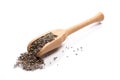 Close-up of pile of raw dark chia seeds in a wooden spoon on white background Royalty Free Stock Photo