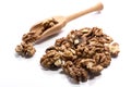 Close-up of pile of raw walnuts in a wooden spoon on white background Royalty Free Stock Photo