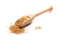 Close-up of pile of raw white mustard seeds in a wooden spoon on Royalty Free Stock Photo