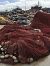 Close up of pile of red fishing nets in busy port, Essaouira, Morocco Royalty Free Stock Photo