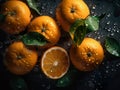 Close up of pile of ripe oranges with stalks and leaves.