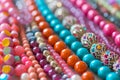 Close up of a pile of shiny colorful beads. Generative AI Royalty Free Stock Photo