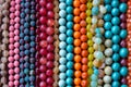 Close up of a pile of shiny colorful beads. Generative AI