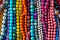 Close up of a pile of shiny colorful beads. Generative AI Royalty Free Stock Photo