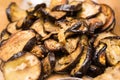 Close up of pile of slices of roasted cooked spicy eggplant