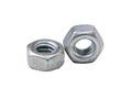 Close up pile of steel Hexagon Nuts or female nippers arranged i