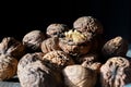 Close up of a pile of walnuts in a shell