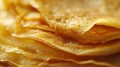 A close up of a pile of yellow crepes with water droplets, AI