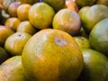 Close-up pile of yellowish green oranges fruit Royalty Free Stock Photo