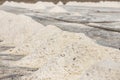 Close up piles of raw white sea salt in the salt farm