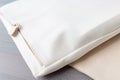 a close up of a pillow with a zipper on the side of it and a pillow case on the other side of the pillow case