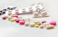 Close-up of the pills on the white background, The drug and capsule pills on the floor, Royalty Free Stock Photo