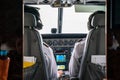 Close up 2 pilots concentrate drive the small private jetplane on the sky Royalty Free Stock Photo