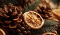 A close up of a pine cone with a dried orange on top Royalty Free Stock Photo