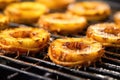 close-up of pineapple rings on a hot grill