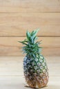 Close up Pineapple on wooden background, vertical Royalty Free Stock Photo