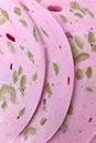 Close-Up of Pink Bologna Slices with Green Olive Pieces for Culinary Design Royalty Free Stock Photo