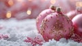 Close-up of pink Christmas ornaments with a snowy background Royalty Free Stock Photo