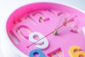 Close up pink clock.