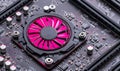 Close-up of a pink computer fan on a circuit board, highlighting its cooling function within the complex electronic system Royalty Free Stock Photo