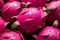Close up of pink exotic dragonfruit fruit in pile