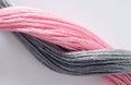 Close up of pink gray colored threads. Royalty Free Stock Photo