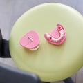 Close-up of pink gypsum dental model of human teeth that doctor will present to patient. Royalty Free Stock Photo