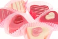 Close-up of a pink heart shaped petit fours cakes seen from the side Royalty Free Stock Photo