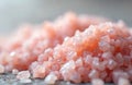 Close up of pink Himalayan salt crystals on a grey surface. Selective focus on the crystals in the foreground. Crystals are pink Royalty Free Stock Photo