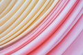 Close up of pink and light yellow color curved curtain texture and abstract background Royalty Free Stock Photo
