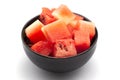 Close-up of pink organic watermelon citrullus Lanatus pieces or diced or sliced in black bowl Royalty Free Stock Photo