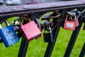 Close up of Pink Padlock on the metal balustrade on the bridge a