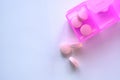 Close up of pink pills on pill contianer Royalty Free Stock Photo