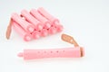 Close up pink plastic curler for hairstyle