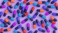 Close up of pink and purple medicine capsules. Medical supplies 3D render illustration. Medicine and healthcare concept