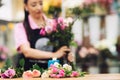 Close-up of pink roses lying on a table in a flower shop, from which the florist makes a bouquet. Blurred background Royalty Free Stock Photo